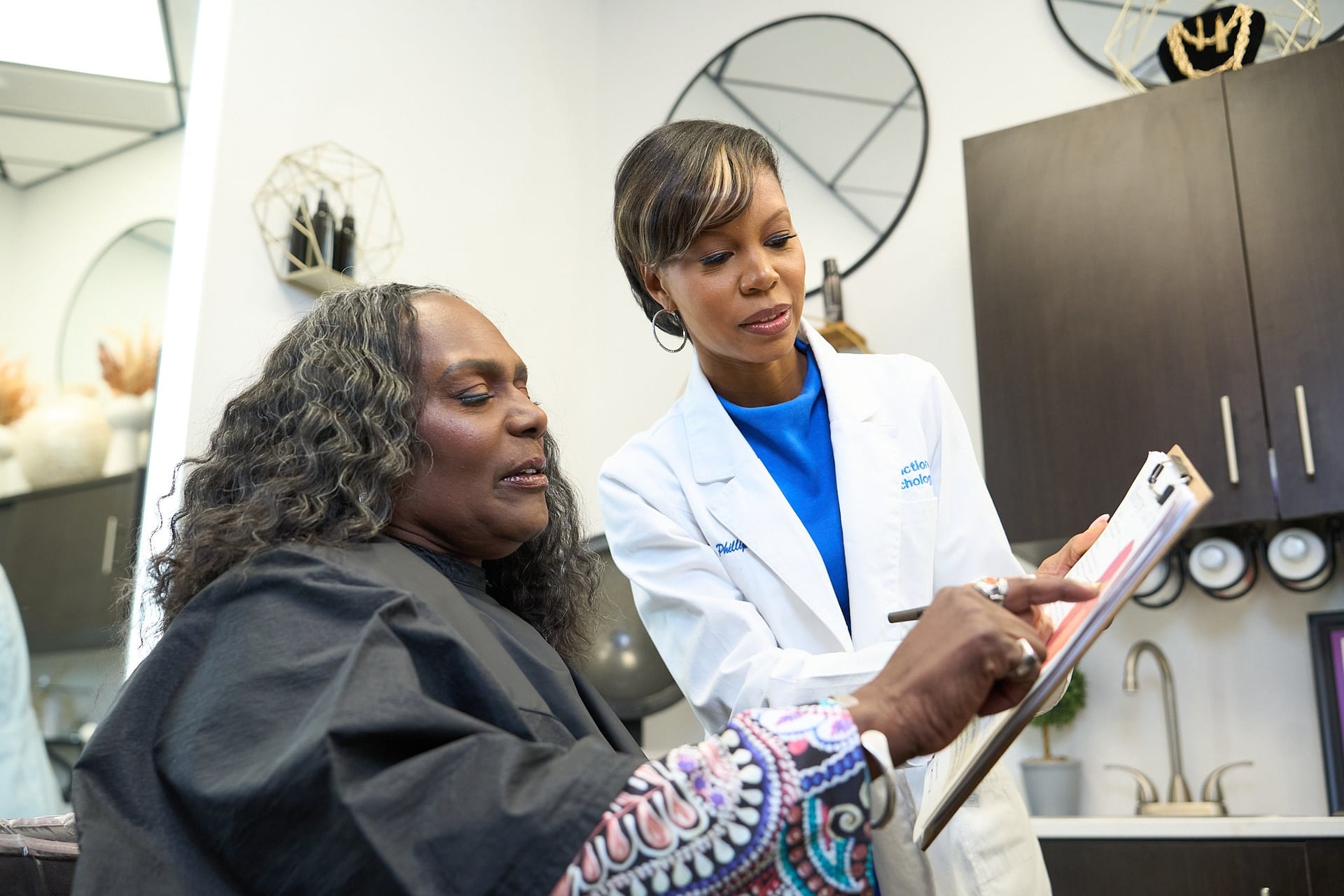 Shameika Bolden reviewing consultation information with a client